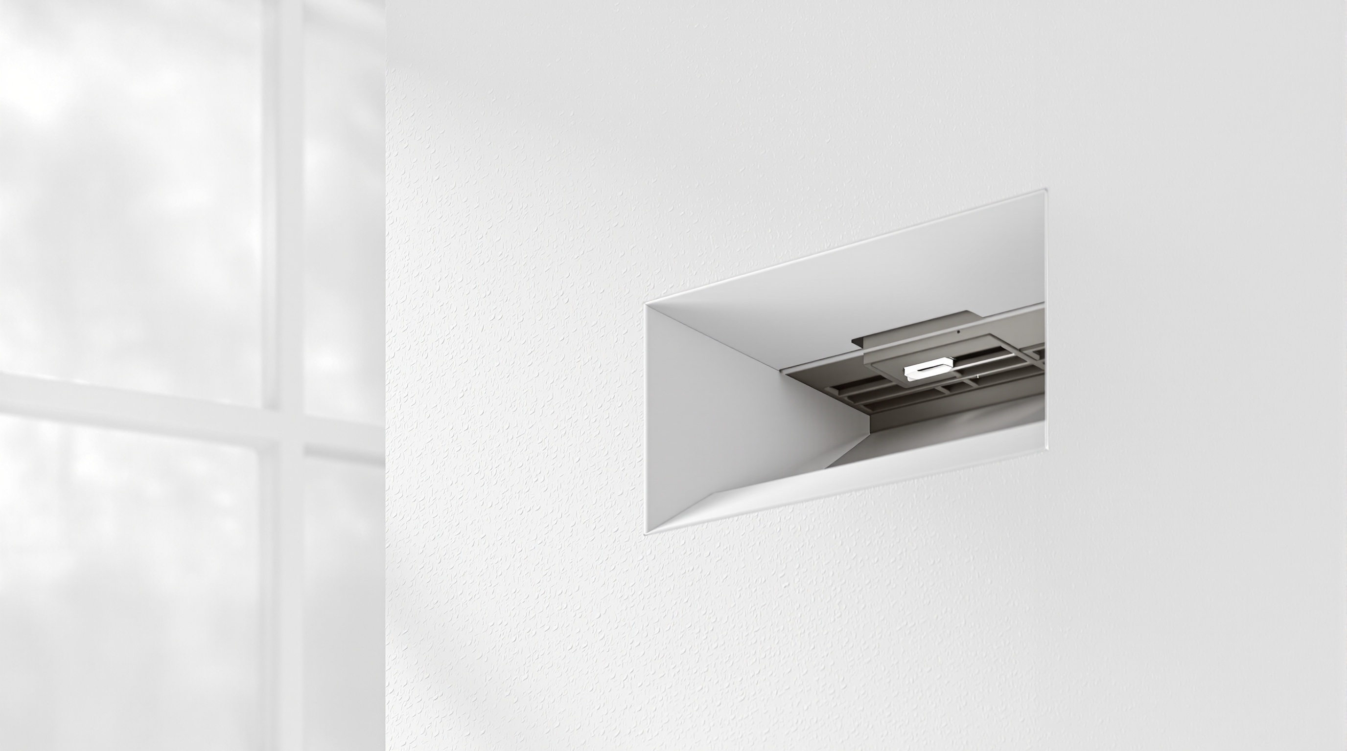 Installation d'une VMC sans conduit élégamment intégrée dans un mur moderne